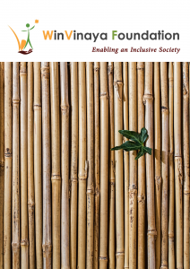 A picture of a plant that sprouted through a bamboo fence and thrived.
