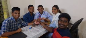 A photo of candidates posing with the clay model they have prepared.